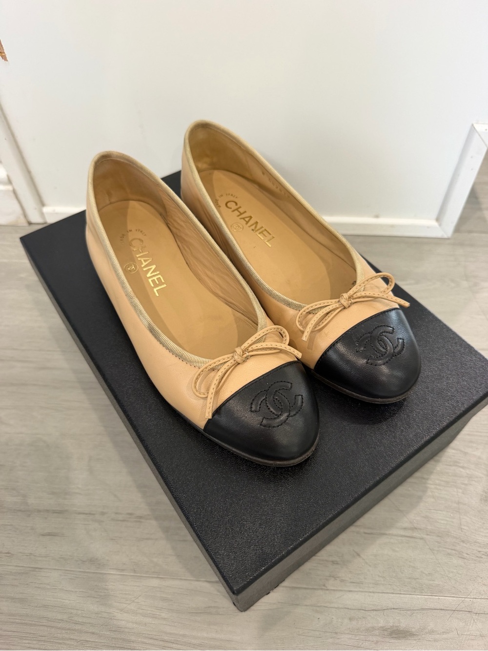 CHANEL Beige Leather Ballet Flats with Black Cap Toe